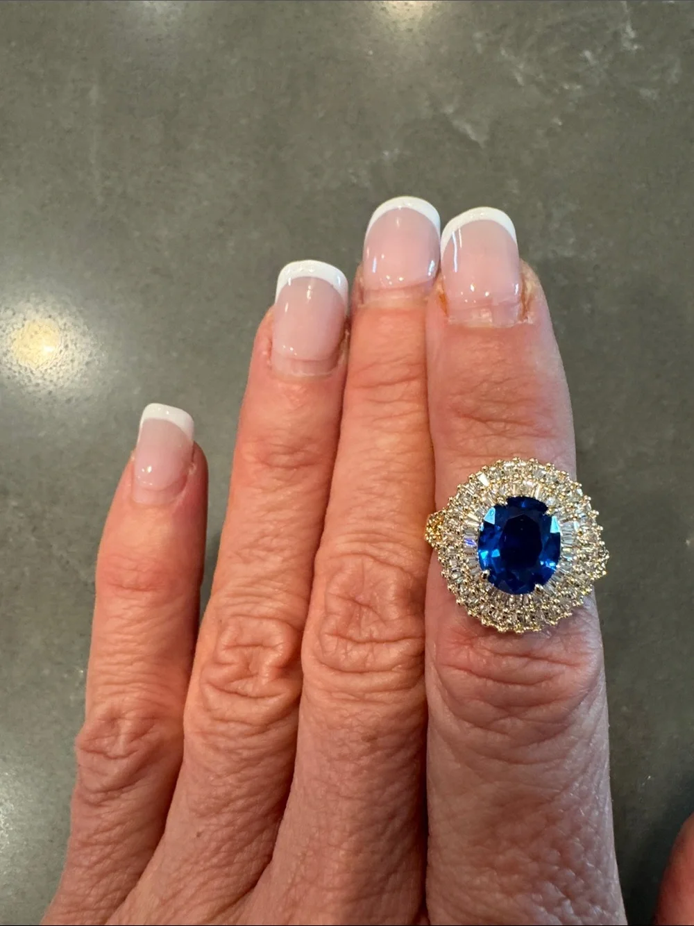 BP Gold Cocktail Ring with Deep Blue Center Stone and Halo Diamonds